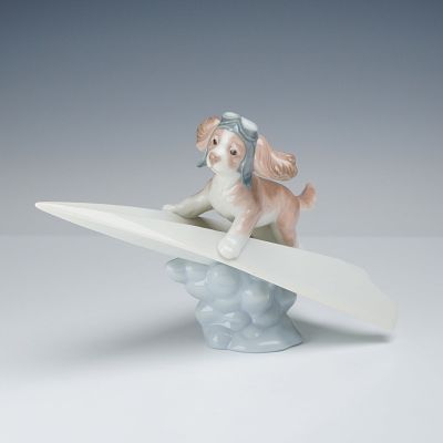 Lladro Porcelain Dog Figurine, Let's Fly Away 01006665. This glazed porcelain figurine, titled 