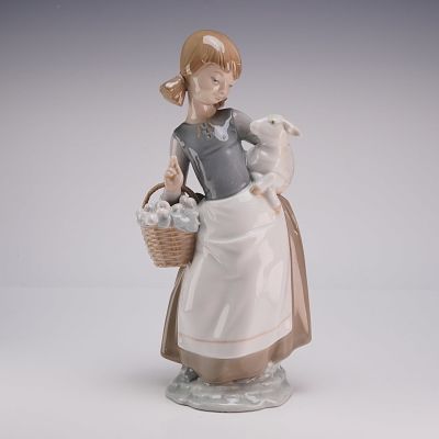 Lladro Porcelain Figurine Girl with Lamb 01004835. A glazed porcelain figurine produced by 