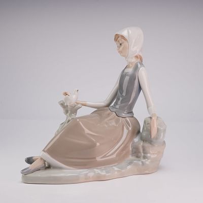 Lladro Porcelain Figurine Shepherdess with Dove 01004660. This Lladro porcelain figurine, titled 