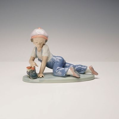 Lladro Porcelain Figurine, All Aboard 1007619. Issued for the Collectors Society in 1993. The 