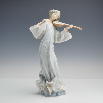 Lladro Porcelain Figurine, Angel with Mandolin 1001324. This glossy porcelain figure depicts a 