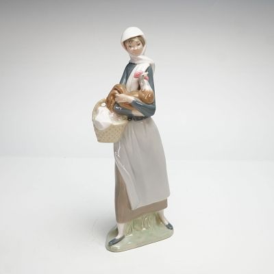 Lladro Porcelain Figurine, Girl with Cockerel 1004591. This polychrome glazed porcelain piece 