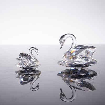 2pc Swarovski Crystal Swan Figurines. This lot consists of two Swarovski crystal figurines 