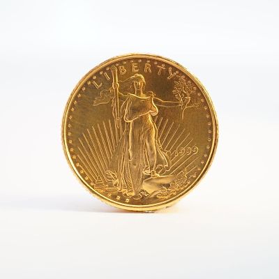 1999 1/10 Fine Gold $5 American Gold Eagle Coin. Minted by the Philadelphia Mint. The obverse 