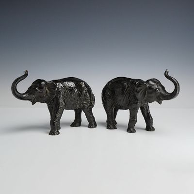 2pc Cast Metal Elephant Figurines with Raised Trunks. This lot of 2 metal elephants features 