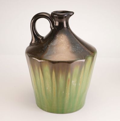 Fulper Pottery Green and Black Luster Musical Jug. Stoneware jug finished in a lustrous green 