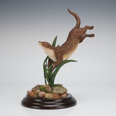 Country Artists Otter Swimming Figurine. A wildlife figurine crafted by Country Artists of 