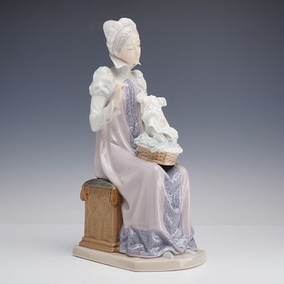 Lladro Porcelain Figurine Sewing a Trousseau 01005126. Lladro glazed porcelain figurine depicts 