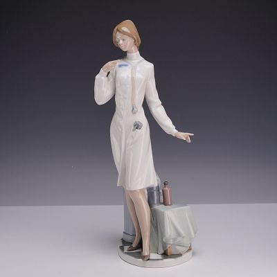 Lladro Porcelain Figurine, Female Physician, Model 5197. Lladro glazed porcelain figurine titled 
