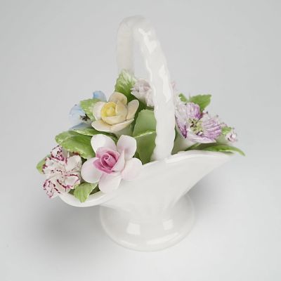 Royal Doulton Bone China Figurine, Handled Basket of Flowers. The figurine features a stylized 