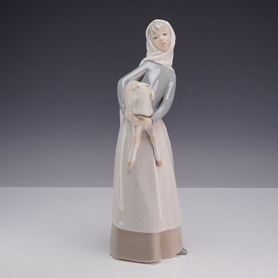 Lladro Porcelain Figurine Girl with Lamb Model 4584. A Lladro glazed porcelain figurine, model 