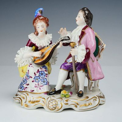 Volkstedt German Dresden-Style Lace Porcelain Courting Couple Figurine. A polychrome 