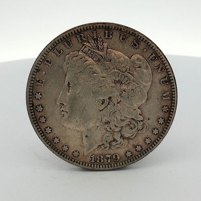 1879 US One Dollar Morgan Silver Dollar, Circulated. This US 1879 Morgan silver dollar is a 