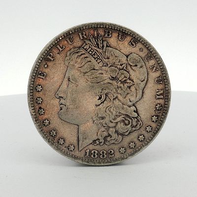 1882-S US One Dollar Morgan Silver Dollar, Circulated. This US 1882-S Morgan silver dollar is a 