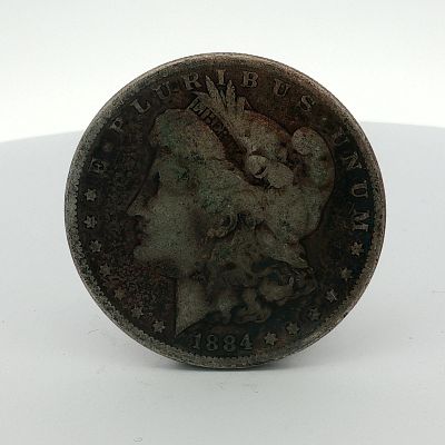1884 US One Dollar Morgan Silver Dollar, Circulated. This US Morgan dollar is dated 1884 and was 