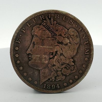 1894-S US Morgan Silver Dollar. This US 1894-S Morgan silver dollar is a struck coinage issue 