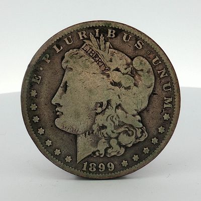 1899-O US Morgan Silver Dollar. This US 1899 Morgan dollar was struck at the New Orleans Mint. 