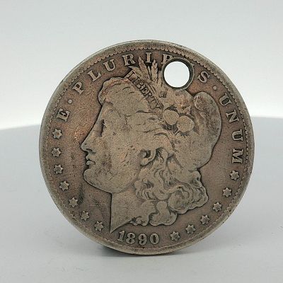 US 1890-CC Morgan Silver Dollar. This US Morgan silver dollar is a Carson City Mint issue. The 