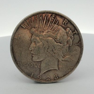 1923-S US One Dollar Peace Silver Dollar Coin, Circulated. US Peace silver dollar dated 1923. 