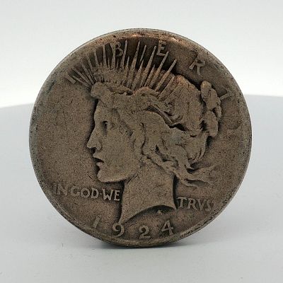 1924-S US One Dollar Peace Silver Dollar Coin, Circulated. This 1924-S US Peace silver dollar is 
