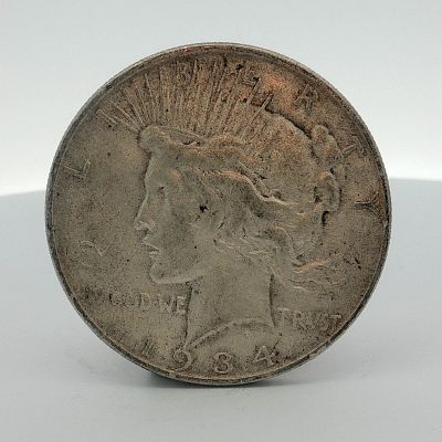 1934-D US One Dollar Peace Silver Dollar, Circulated. This US Peace dollar was struck at the 
