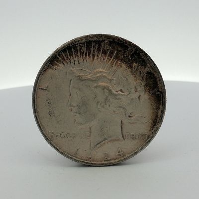 1924 US Peace Silver Dollar. A 1924 US Peace silver dollar, struck at the Philadelphia Mint. 