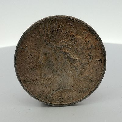 1924 US Peace Silver Dollar. This US Peace Silver Dollar is dated 1924 and composed of 90 
