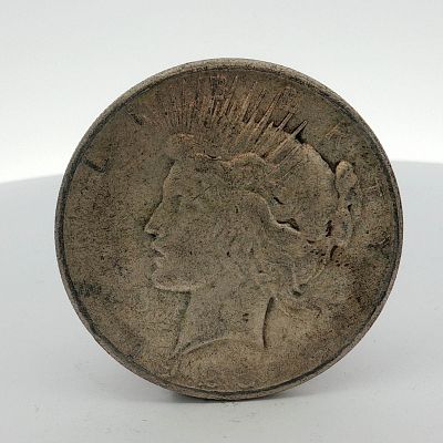 1925-S US Peace Silver Dollar. This US Peace silver dollar is composed of silver. The obverse 