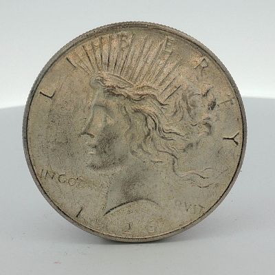 1926 US Silver Peace Dollar. This 1926 US silver Peace dollar is a struck coin composed of 90% 
