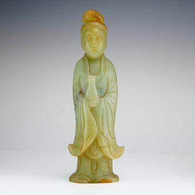 Chinese Carved Jade Figurine Depicting Guanyin. A Chinese carved nephrite figurine depicting 