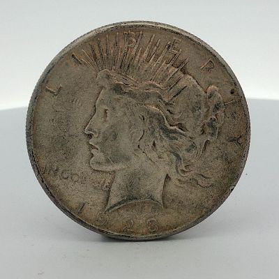 US 1923-S Peace Silver Dollar. This United States 1923-S Peace silver dollar was struck at the 