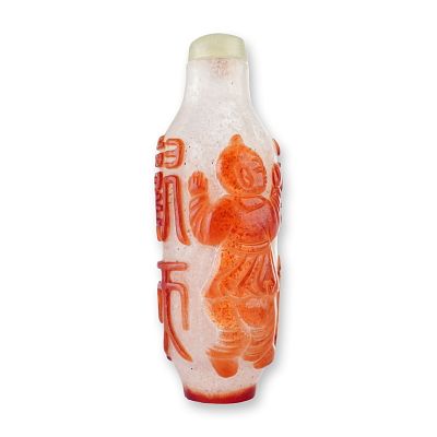 Peking Glass Snuff Bottle, Brown Overlay Boys and Archaic Script. A clear cylindrical snuff 