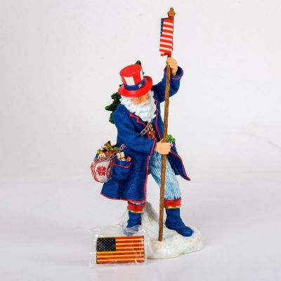 Pipka Figurine, Patriotic Collection. Blue, red and white Santa with flag. Gilded details in 