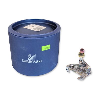 Swarovski Crystal Playing Seal Figurine. Swarovski figurine depicting a sea lion balancing two 