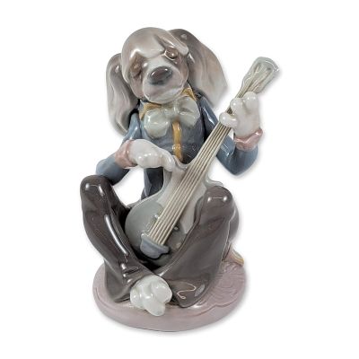 Lladro Porcelain Figurine Dog Playing Guitar. A whimsical anthropomorphic figurine titled Dog 