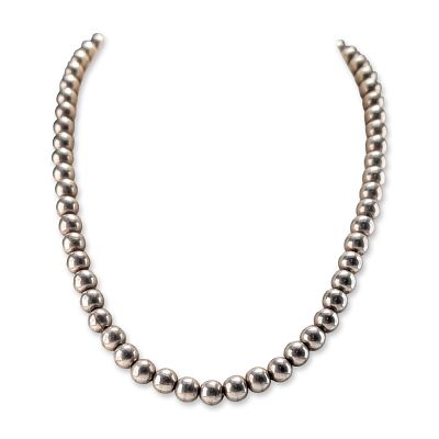 Silver Toned Spherical Bead Necklace. Silver toned brass bead necklace featuring a single strand 