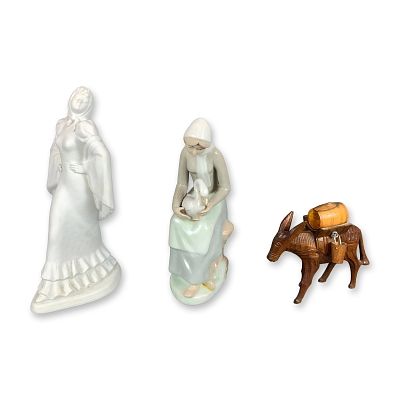 3pc Porcelain and Wood Figurines. This collection includes three decorative figurines. The first 