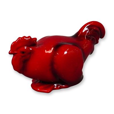 Royal Doulton Flambe Porcelain Bird Figurine, Cockerel Crouch. In a fired red glaze the figure 