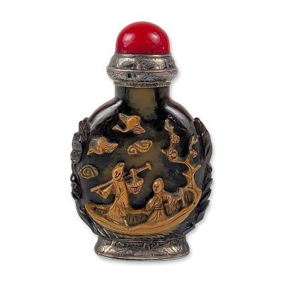 Chinese Carved Stone Snuff Bottle. A snuff bottle in carved stone with silver-tone metal mounts. 