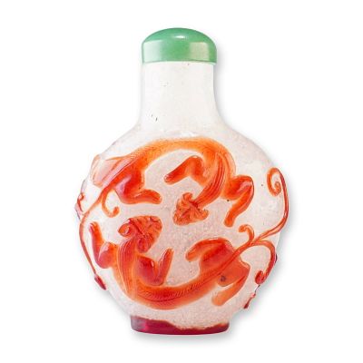 Peking Glass Snuff Bottle, Brown Overlay Qilin and Chilong. A clear round snowflake Peking glass 