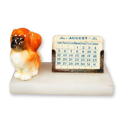 Royal Doulton Porcelain and Sterling Silver Onyx Desk Calendar, Pekinese Puppy Seated HN832. A 