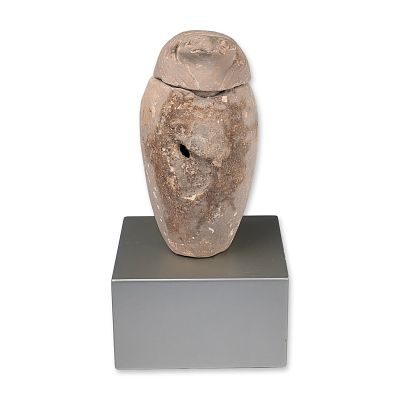 Egyptian Carved Stone Falcon Canopic Jar, Qebehsenuef. Carved light-colored stone vessel 