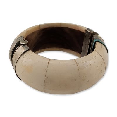 Bone and Metal Hinged Bangle. Vintage hinged bangle bracelet featuring segmented natural bone 