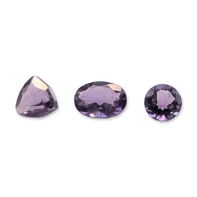 Trio of Purple Faceted Amethyst Gemstones. Trio of loose faceted amethyst gemstones, featuring a 