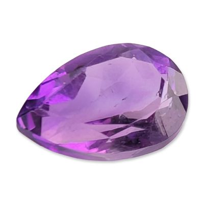 Pear Cut Purple Amethyst Gemstone. A pear cut loose gemstone appears to be amethyst, featuring a 