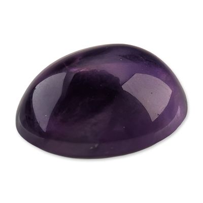 Loose Oval Amethyst Cabochon Gemstone. A loose gemstone that appears to be a natural amethyst. 