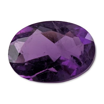 Oval Faceted Amethyst Loose Gemstone. Oval faceted amethyst gemstone, featuring a saturated deep 