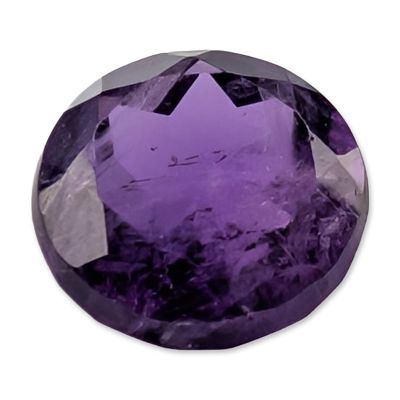 Oval Faceted Purple Amethyst Gemstone. A single loose faceted amethyst gemstone of deep 
