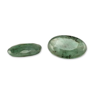 Pair of Oval Faceted Green Emerald Gemstones. Pair of oval faceted green emerald gemstones. 