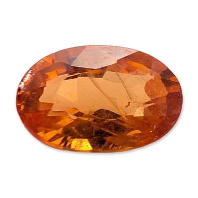 Oval Cut Orange Spessartite Garnet. Oval mixed cut loose gemstone appearing to be an orange 